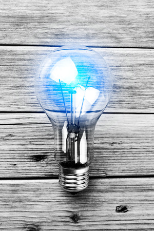 bulb on the brown wooden background の写真素材