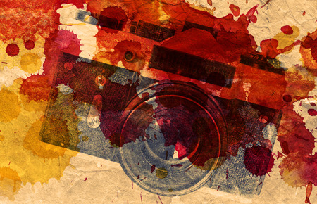 Retro camera on paper backgroundの写真素材