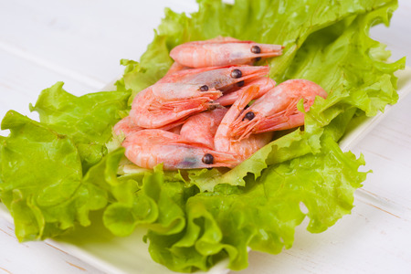Shrimps on white wooden backgroundの写真素材