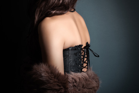 woman wearing corset and fur in retro styleの写真素材