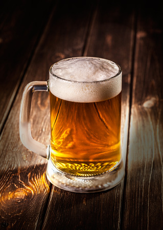 mug of beer on wooden backgroundの写真素材