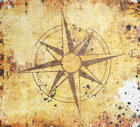 Old compass on paper backgroundの写真素材