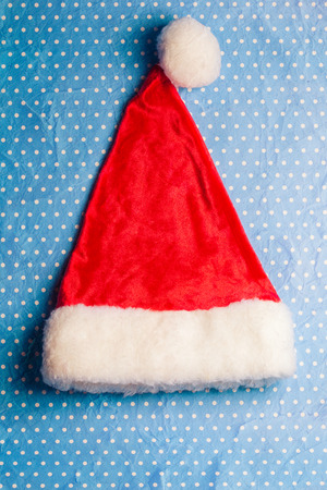 Santa Claus red hat on blue backgroundの写真素材
