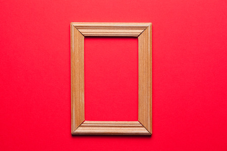 wooden frame on red backgroundの写真素材