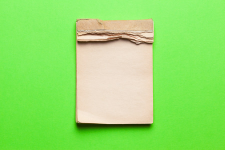 old notebook on green backgroundの写真素材