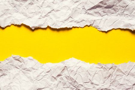 Torn Paper with space for text on yellow backgroundの写真素材