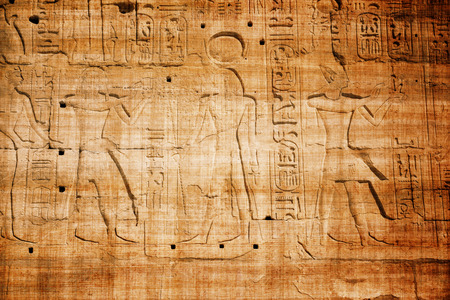 old egypt hieroglyphs carved on the stone with papyrus scratchesの写真素材