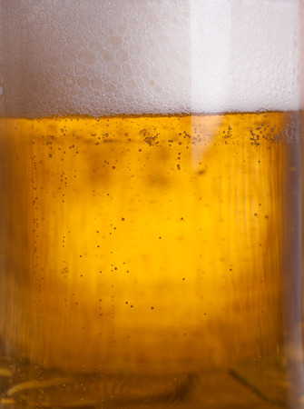 Glass beer on wood backgroundの写真素材
