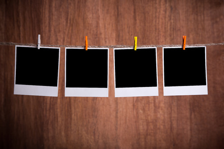 Blank instant photo hanging on the clotheslineの写真素材