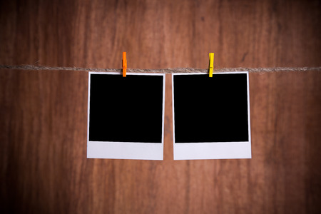 Blank instant photo hanging on the clotheslineの写真素材