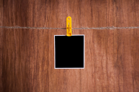 Blank instant photo hanging on the clotheslineの写真素材