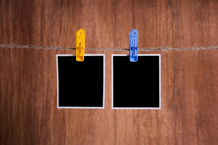 Blank instant photo hanging on the clotheslineの写真素材