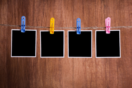 Blank instant photo hanging on the clotheslineの写真素材