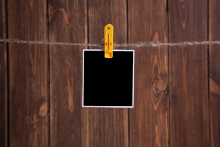 Blank instant photo hanging on the clotheslineの写真素材
