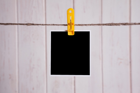 Blank instant photo hanging on the clotheslineの写真素材