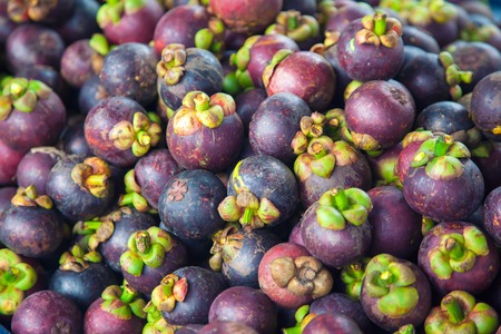 Mangustin's fruit at the market close up imageの写真素材