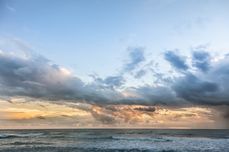 Beautiful sunrise with clouds in the indian sea