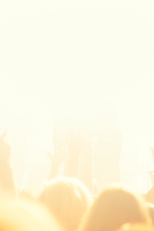 Silhouettes of people and musicians in big concert stageの写真素材