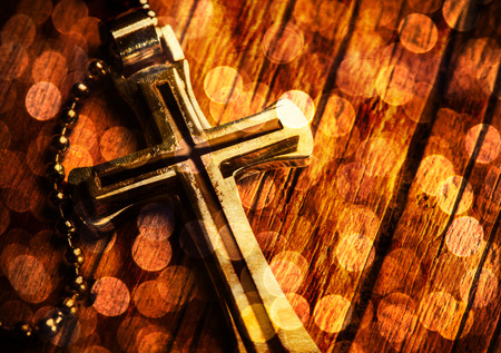 Closeup of silver Christian cross on bibleの写真素材