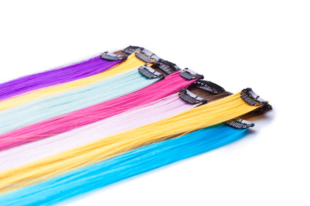 Color clip in hair extension, closeup on whiteの写真素材