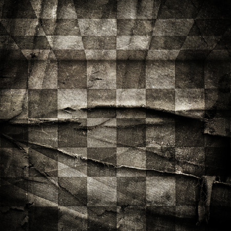 Grungy chessboard background with scratches on old canvasの写真素材