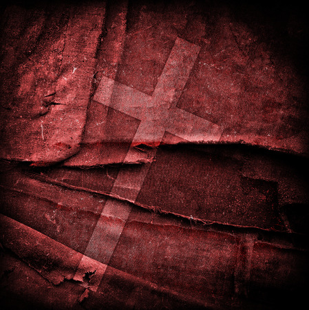 cross on abstract grunge background with scratches and stainsの写真素材
