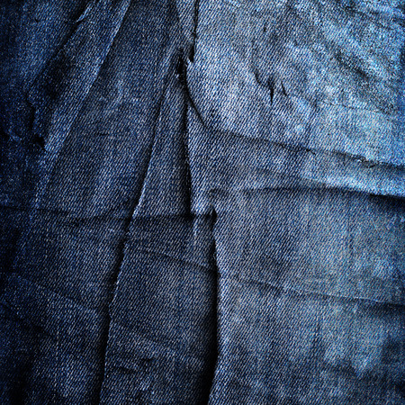 abstract grunge jeans background with folds and scratchesの写真素材