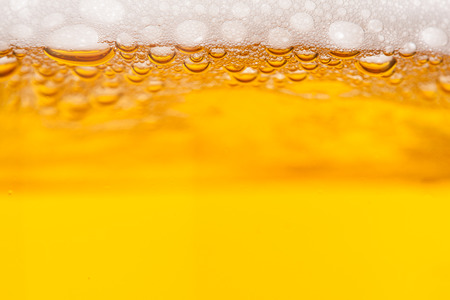 Beer bubbles in a mug, close-up image
