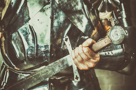 knight wearing armor and holding two-handed swordの写真素材