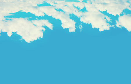 Beautiful sky clouds background with a sun flashの写真素材