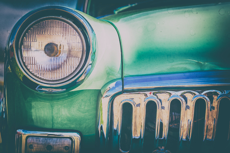 Close-up photo of retro car headlightsの写真素材
