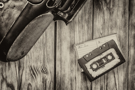 old cassette tape and player on the old brown wooden backgroundの写真素材