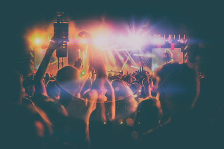 Silhouettes of people and musicians on big concert stageの写真素材