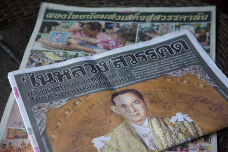 Thailand - October 26,2016 : Newspaper on table with portrait of His Majesty King Bhumibo, and text about death king in 15 Octoberのeditorial素材