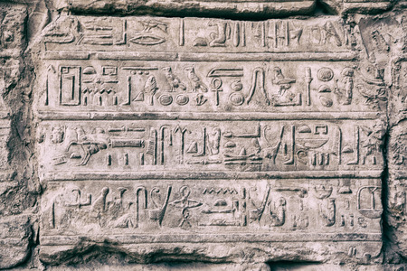 old egypt hieroglyphs carved on the stone