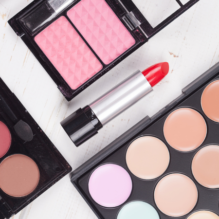 Fashion cosmetic set on a white wooden backgroundの写真素材