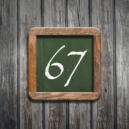 digit on a green wooden blackboardの写真素材