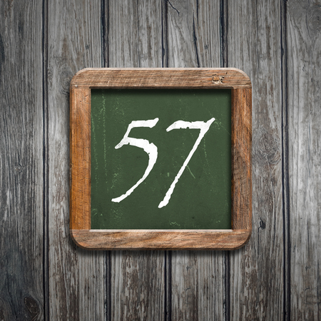 digit on a green wooden blackboardの写真素材
