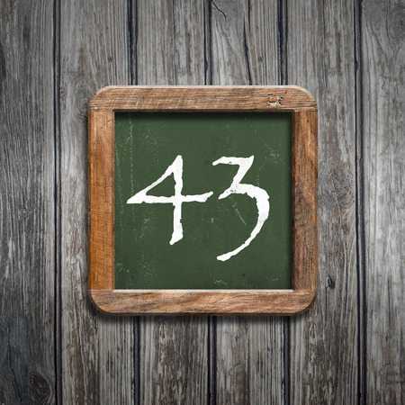 digit on a green wooden blackboardの写真素材