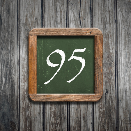 digit on a green wooden blackboardの写真素材