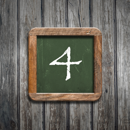 digit on a green wooden blackboardの写真素材