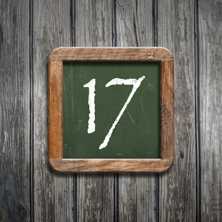 digit on a green wooden blackboardの写真素材