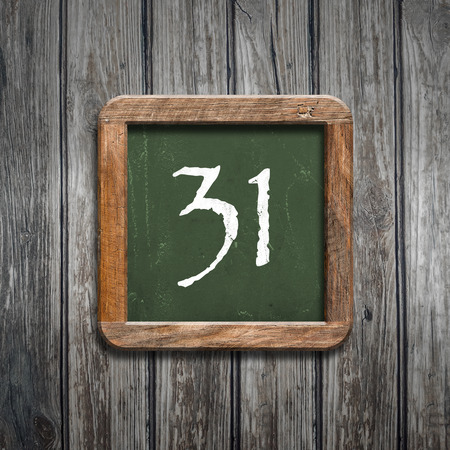 digit on a green wooden blackboardの写真素材