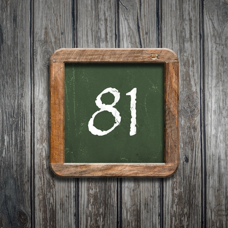 digit on a green wooden blackboardの写真素材