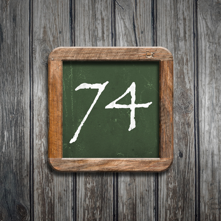 digit on a green wooden blackboardの写真素材