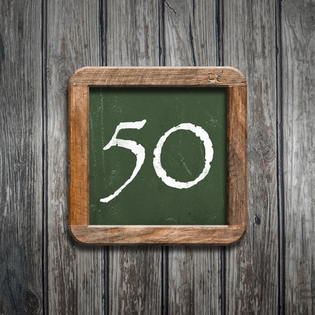 digit on a green wooden blackboardの写真素材