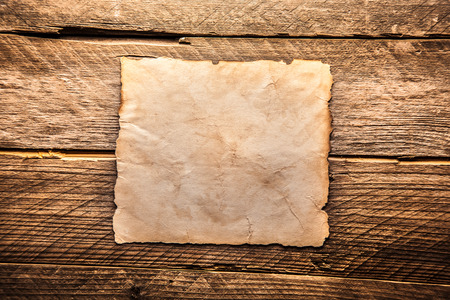 Vintage blank paper on a wooden backgroundの写真素材