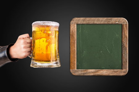 knight holding a mug of fresh beerの写真素材