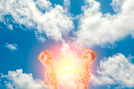 Two hands in chains on a white backgroundの写真素材