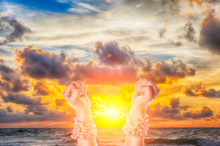Two hands in chains on a white backgroundの写真素材